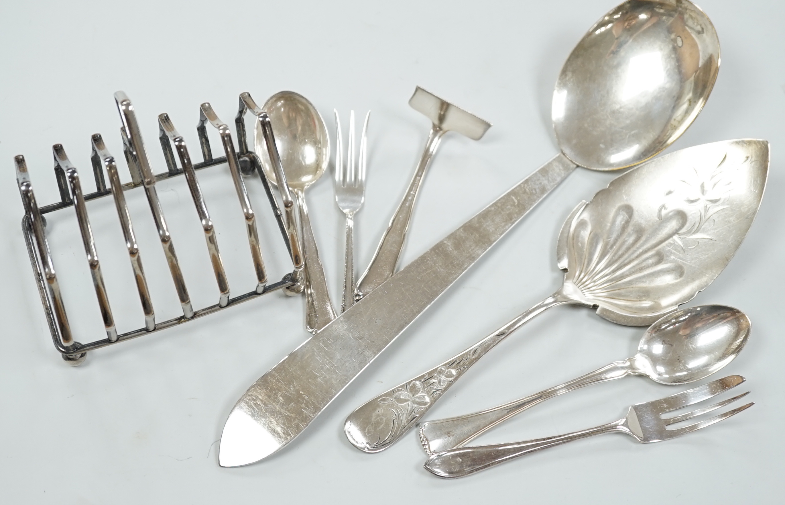 A pair of sterling pepperettes, five other sterling or 800 standard items of flatware and a quantity of silver plated flatware.